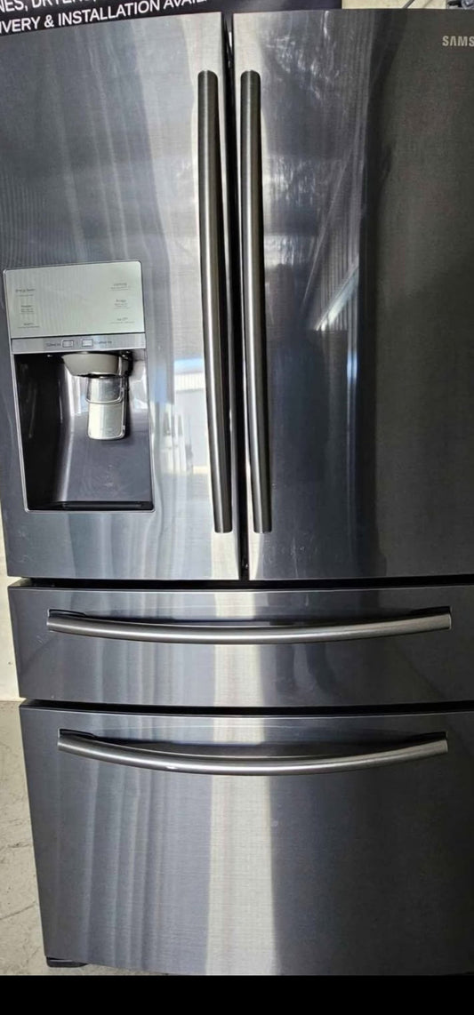 Stainless steel refrigerator with water and ice dispenser on a tiled floor.